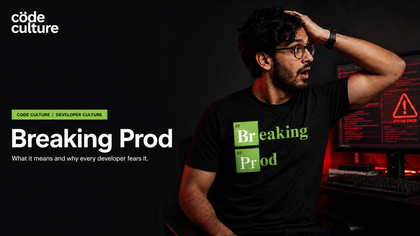 Breaking Prod meaning: developer wearing the Breaking Prod shirt beside a red error screen
