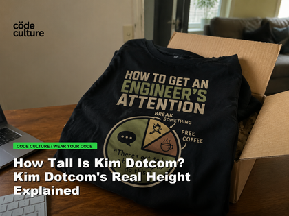 Code Culture blog banner for How Tall Is Kim Dotcom? Kim Dotcom's Real Height Explained, featuring a how to get an engineer attention developer t-shirt.