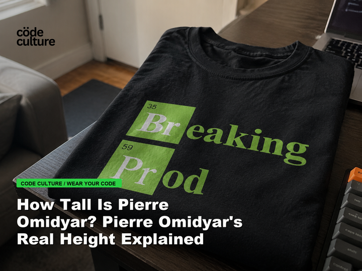 Code Culture blog banner for How Tall Is Pierre Omidyar? Pierre Omidyar's Real Height Explained, featuring a 35 breaking 59 prod developer t-shirt.