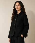 Women's Cropped Button-Front Woolen Jacket for Layering in Black, 02 standing lifestyle, worn by model