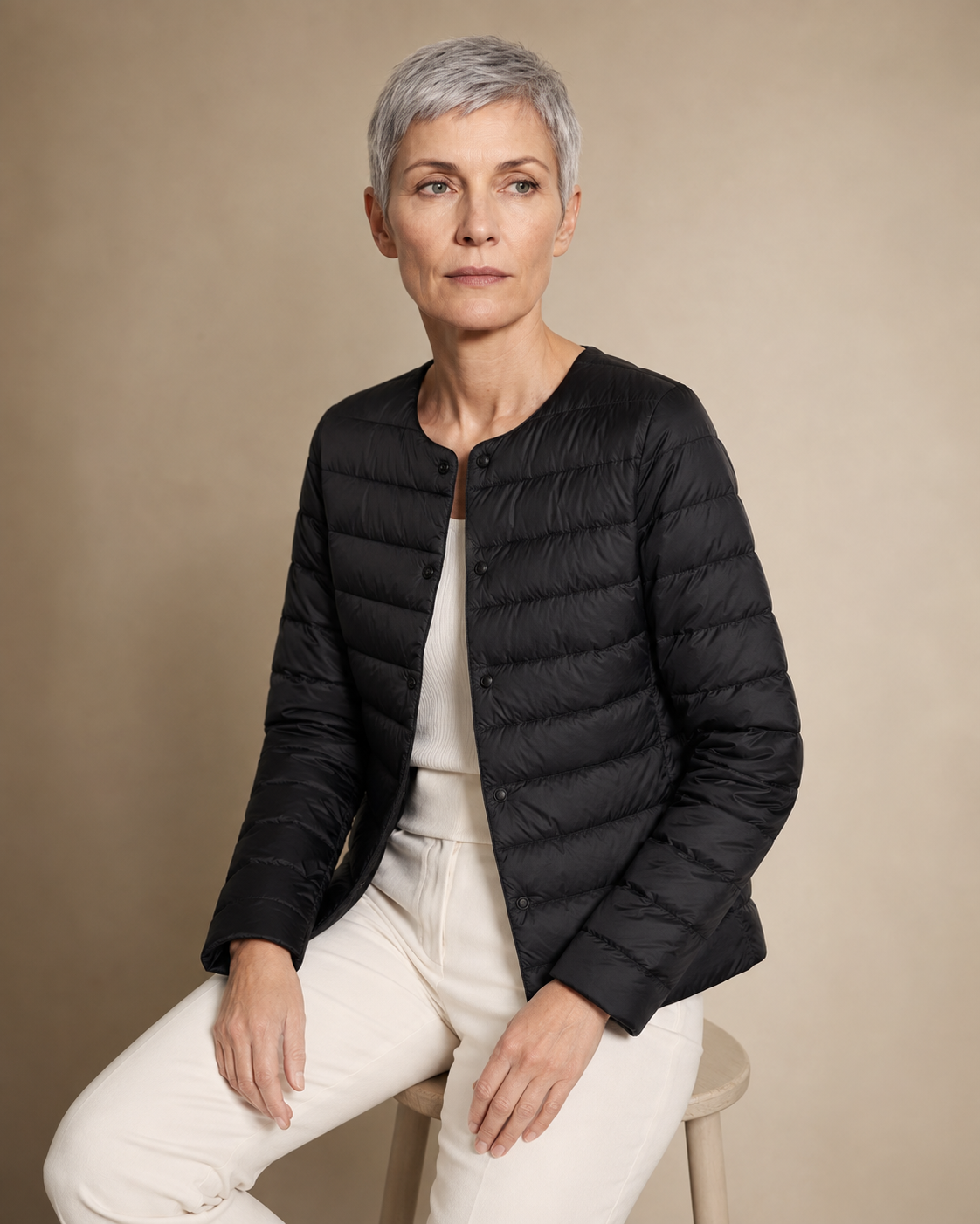 Women's Lightweight Down-Filled Quilted Jacket for Layering in Black, 03 seated or leaning, worn by model
