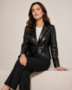 Women's Cropped Faux Leather Blazer with Lapel Collar in Black, 03 seated or leaning, worn by model