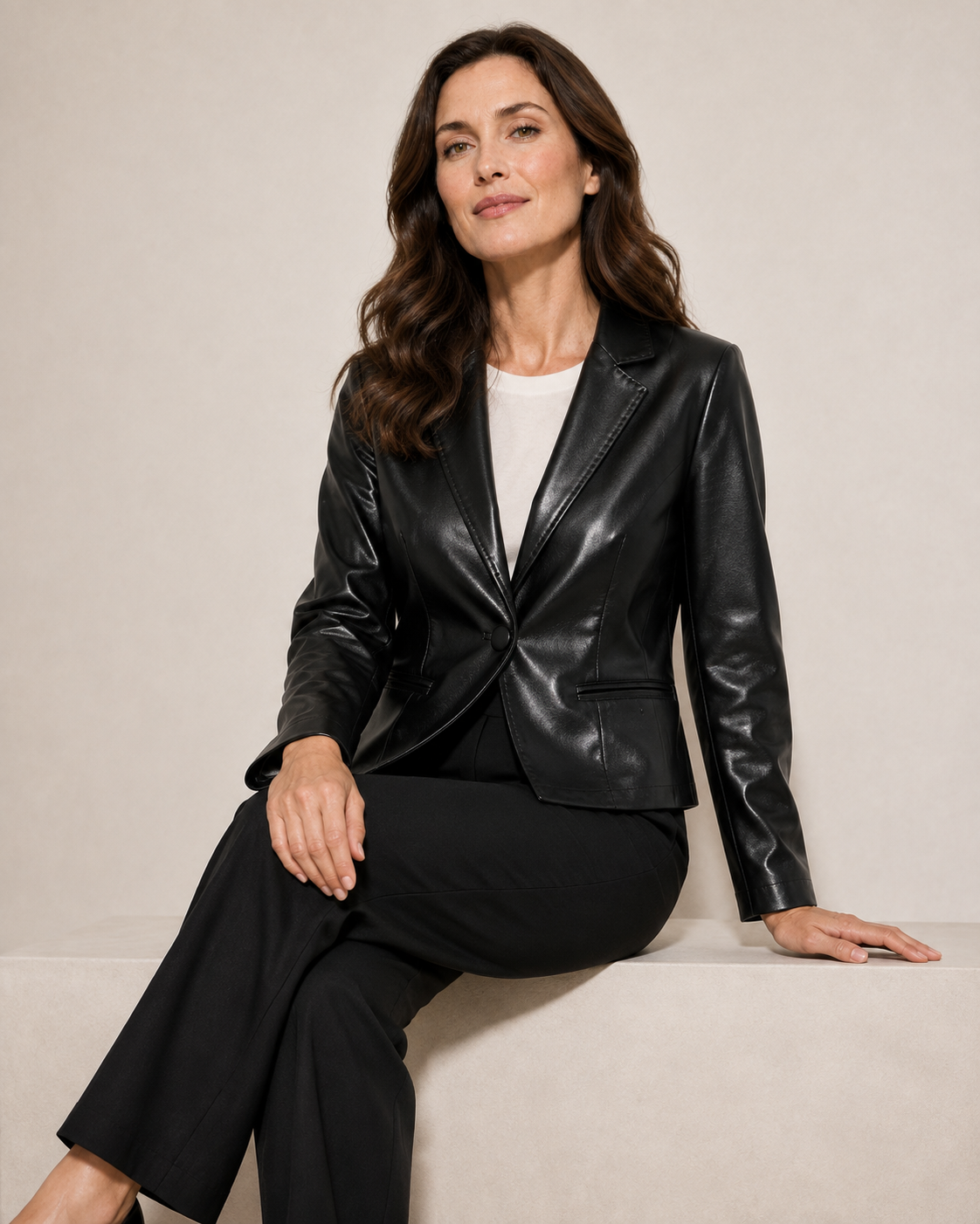 Women's Cropped Faux Leather Blazer with Lapel Collar in Black, 03 seated or leaning, worn by model