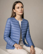 Women's Lightweight Down-Filled Quilted Jacket for Layering in Haze Blue, 03 seated or leaning, worn by model