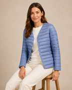 Women's Lightweight Down-Filled Quilted Jacket for Layering in Light Blue, 03 seated or leaning, worn by model