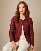 Women's Lightweight Down-Filled Quilted Jacket for Layering in Wine Red, 03 seated or leaning, worn by model