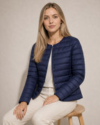 Women's Lightweight Down-Filled Quilted Jacket for Layering in Navy Blue, 03 seated or leaning, worn by model