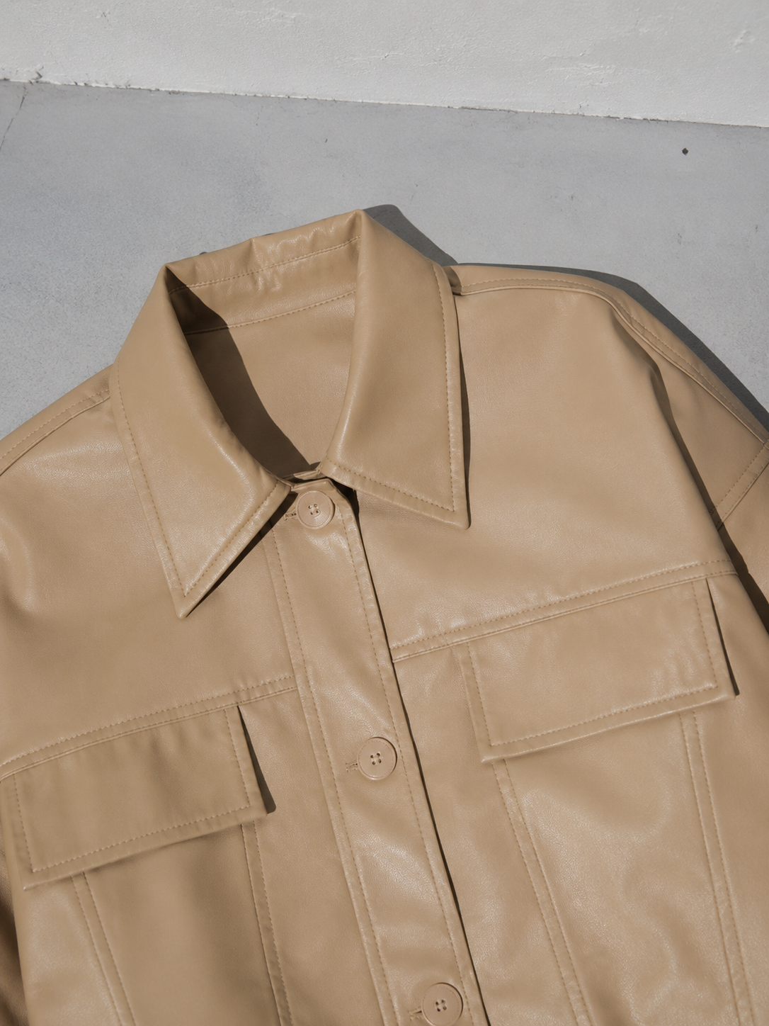 Code Culture catalog | korean-style-lapel-loose-temperament-leather-jacket | color-khaki | macro flat lay