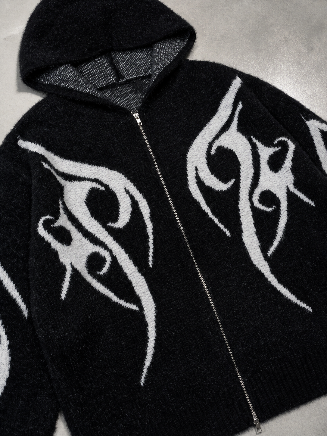 Code Culture catalog | totem-jacquard-contrast-color-hooded-zip-sweater | black | macro flat lay