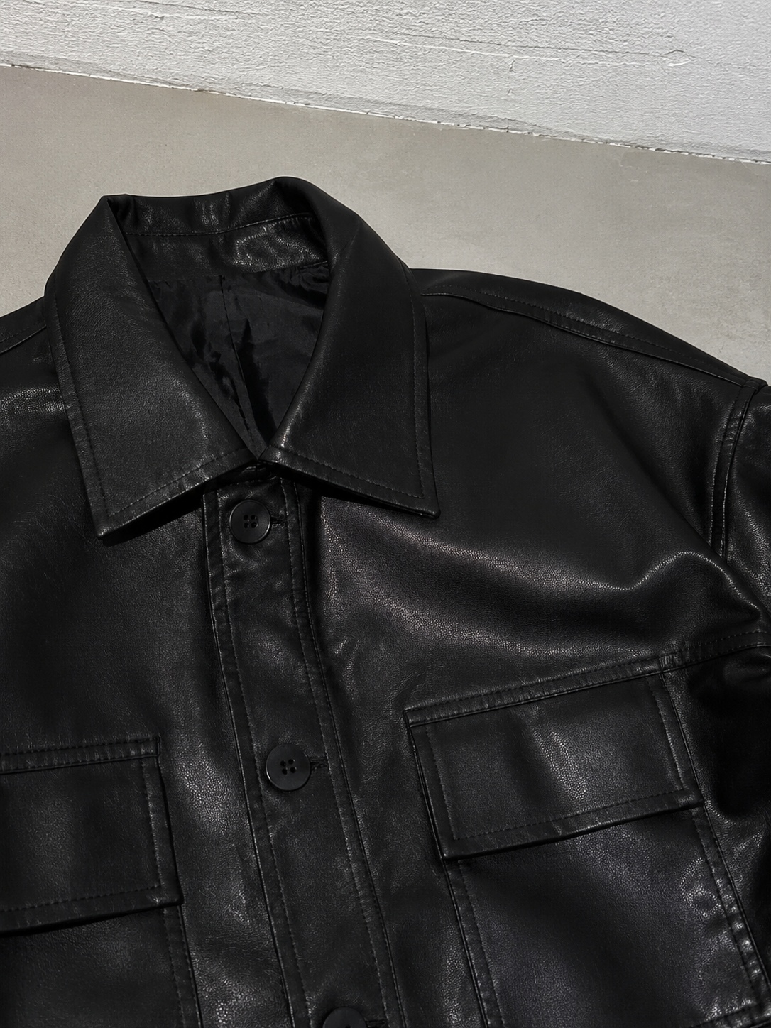 Code Culture catalog | korean-style-lapel-loose-temperament-leather-jacket | color-black | macro flat lay