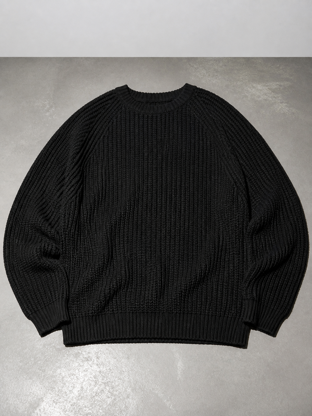 Code Culture catalog | mens-solid-color-long-sleeve-round-neck-fashion-sweater-loose-retro-sweater | black | macro flat lay