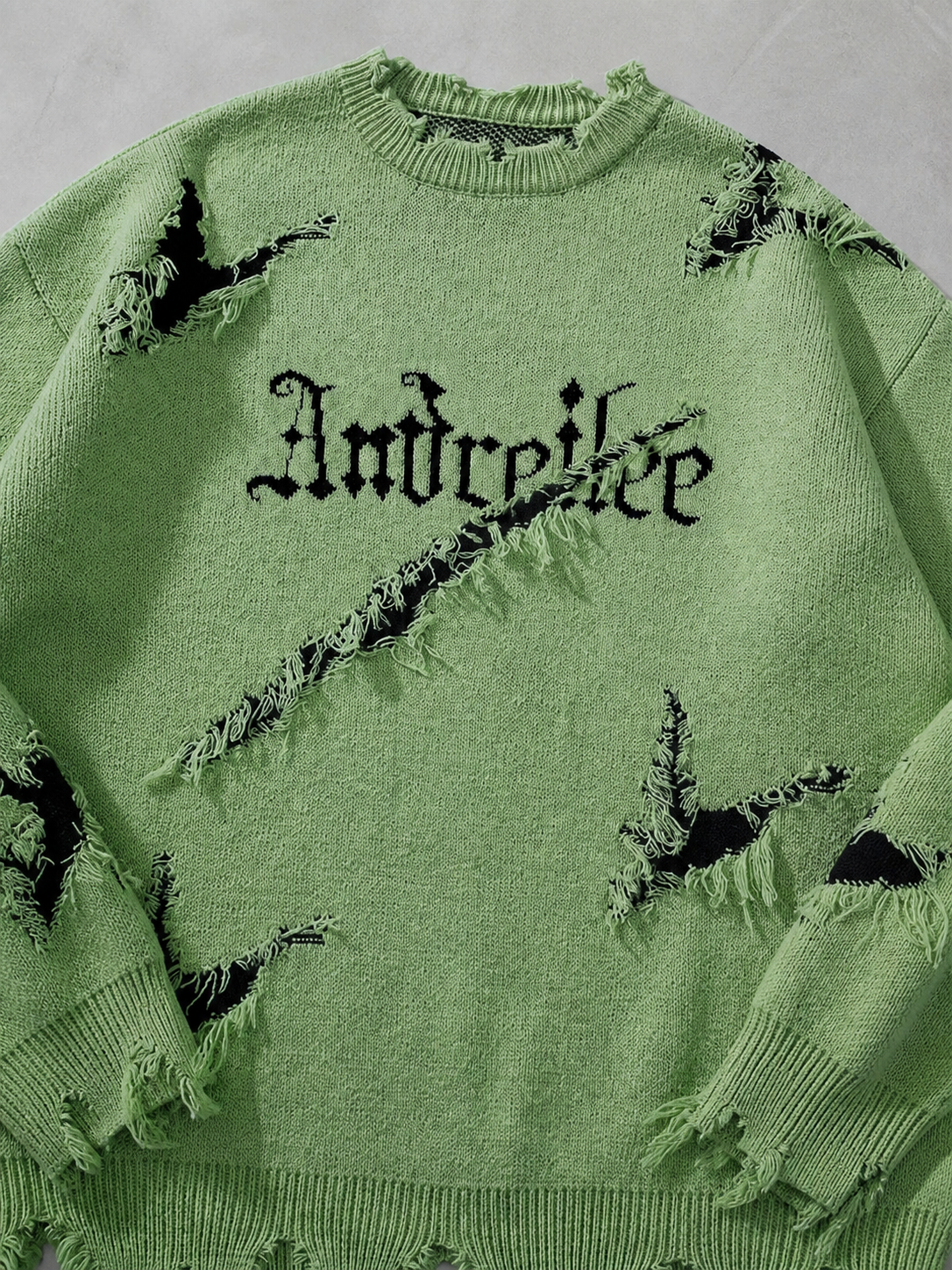 Code Culture catalog | new-personality-street-jacquard-ripped-frayed-vintage-loose-sweater | green | macro flat lay