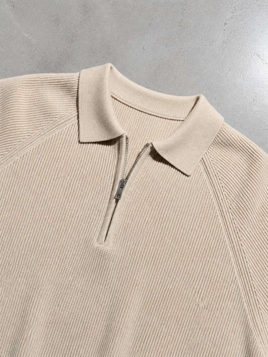 Code Culture catalog | american-casual-half-height-zip-polo-sweater | apricot-colored-rice | macro flat lay
