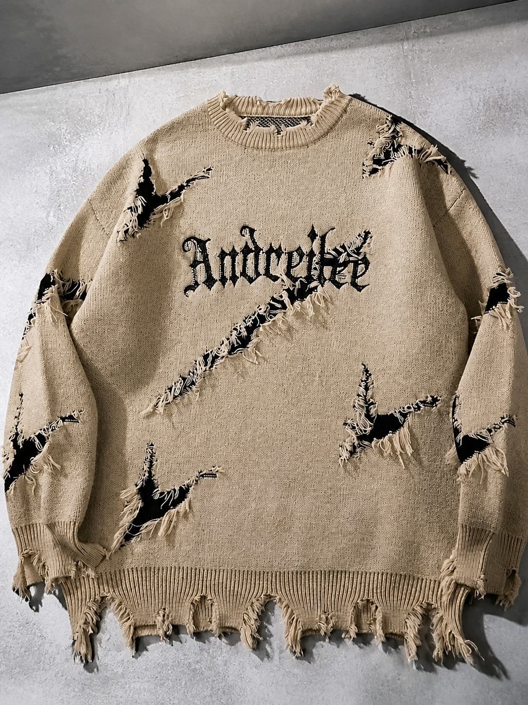 Code Culture catalog | new-personality-street-jacquard-ripped-frayed-vintage-loose-sweater | beige | macro flat lay