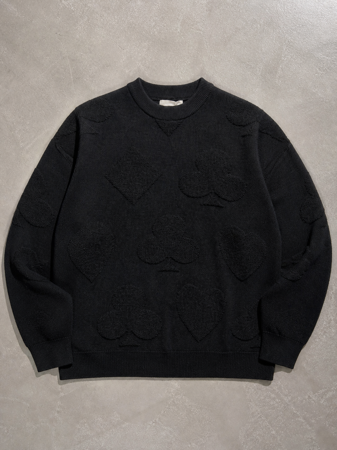 Code Culture catalog | solid-color-jacquard-thermal-sweater | black | macro flat lay