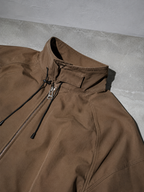 Code Culture catalog | outdoor-shell-jacket-commuting-functional-workwear | color-a003-brown | macro flat lay