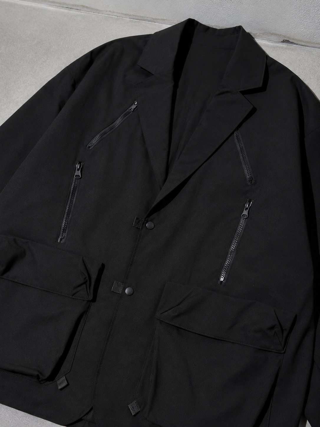 Code Culture catalog | loose-fitting-niche-design-workwear-jacket | color-black | macro flat lay