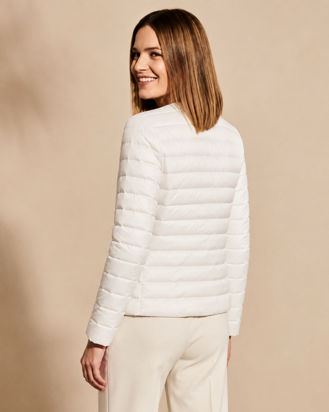 Women's Lightweight Down-Filled Quilted Jacket for Layering in White, 04 back or side, worn by model