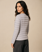 Women's Lightweight Down-Filled Quilted Jacket for Layering in Silver, 04 back or side, worn by model