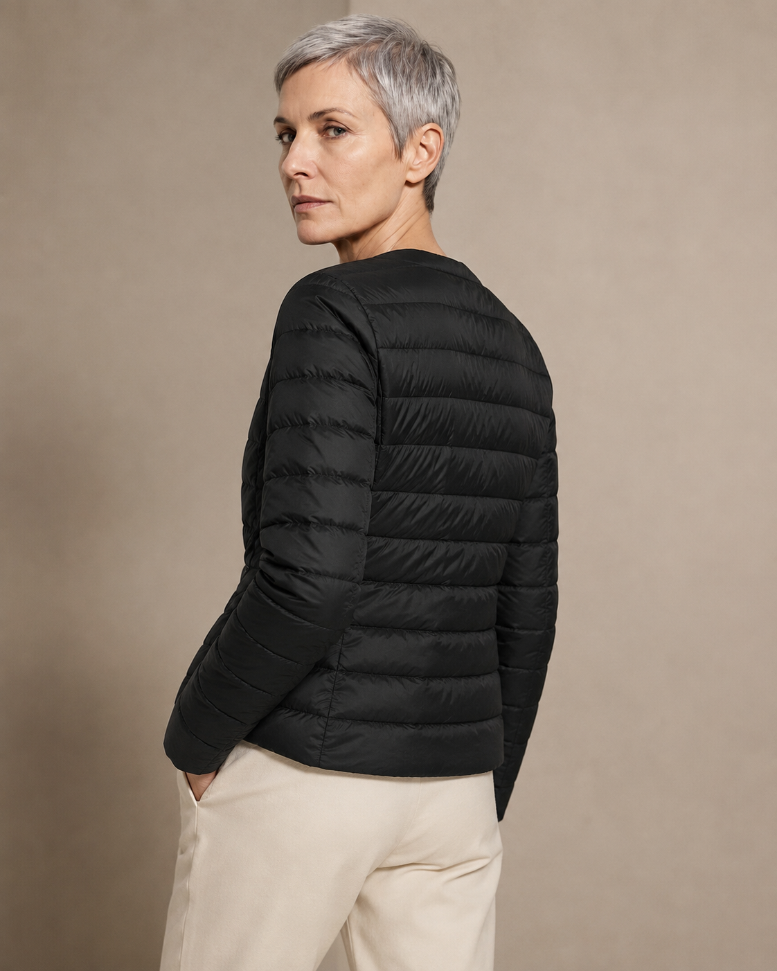 Women's Lightweight Down-Filled Quilted Jacket for Layering in Black, 04 back or side, worn by model