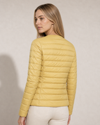 Women's Lightweight Down-Filled Quilted Jacket for Layering in Light Yellow, 04 back or side, worn by model