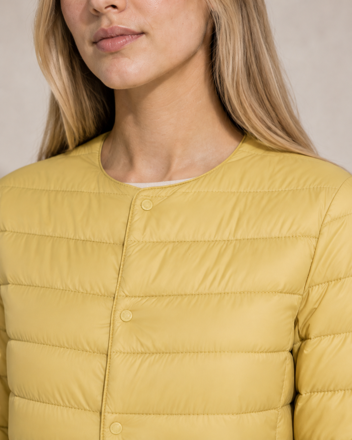 Women's Lightweight Down-Filled Quilted Jacket for Layering in Light Yellow, 05 material macro, worn by model