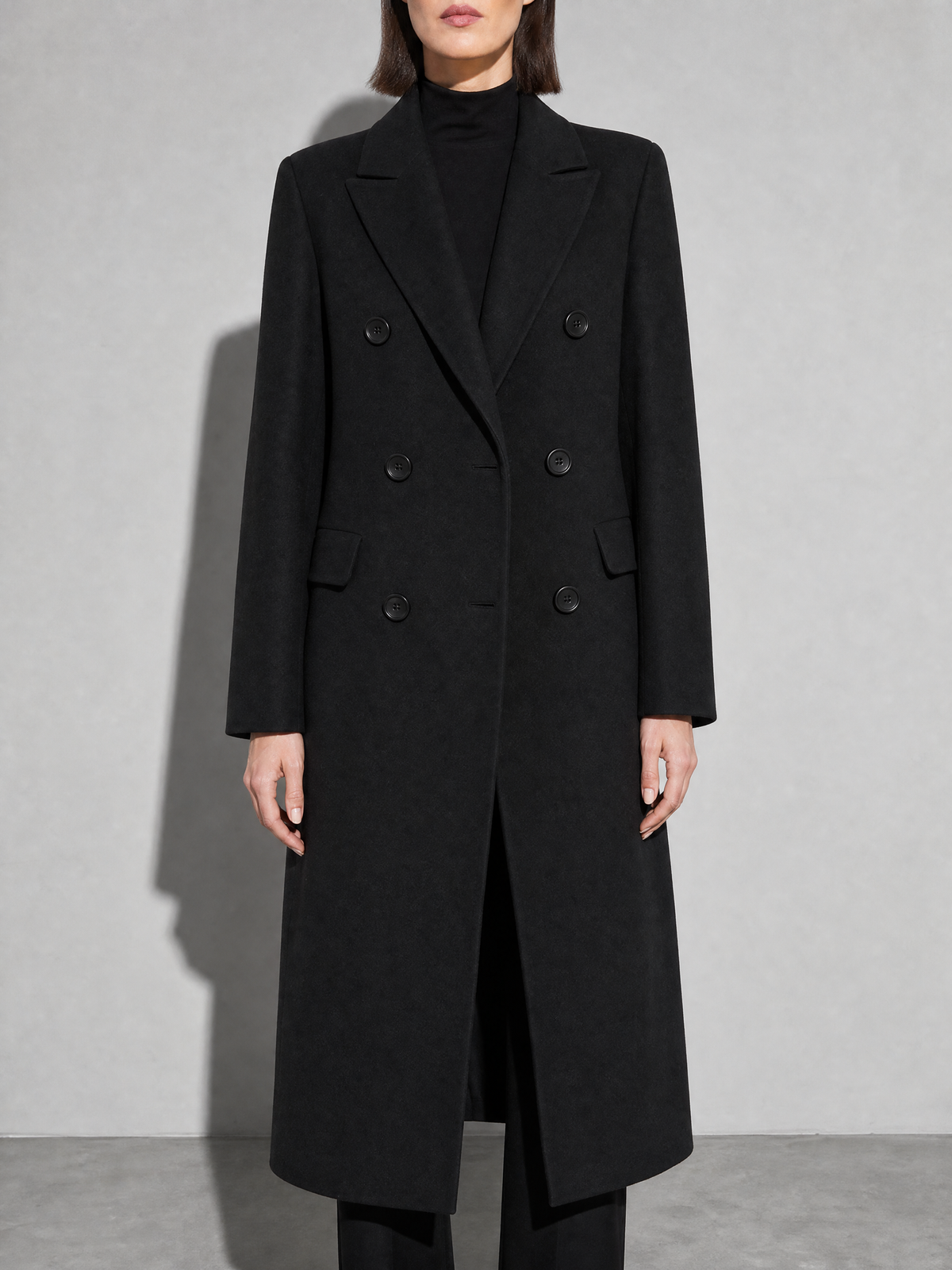 Loose Slim Fit Woolen Coat Mid-length Woolen Coat in Black - bust to thigh view