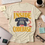 The Call Is Coming from Inside the Codebase Shirt — Natural