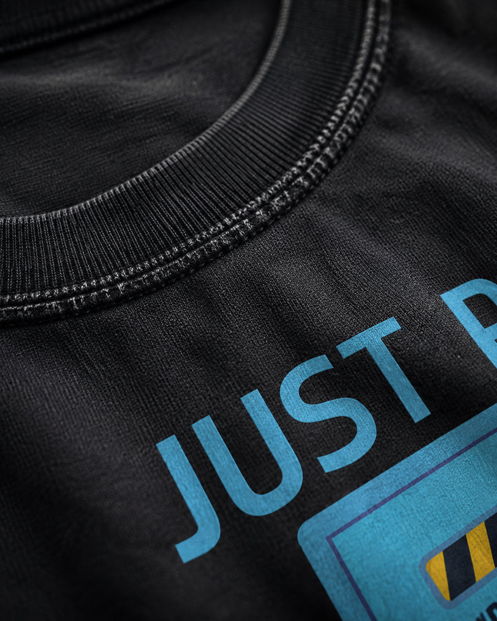 just put in a ticket Premium Shirt — 100% Ringspun Cotton Macro Detail