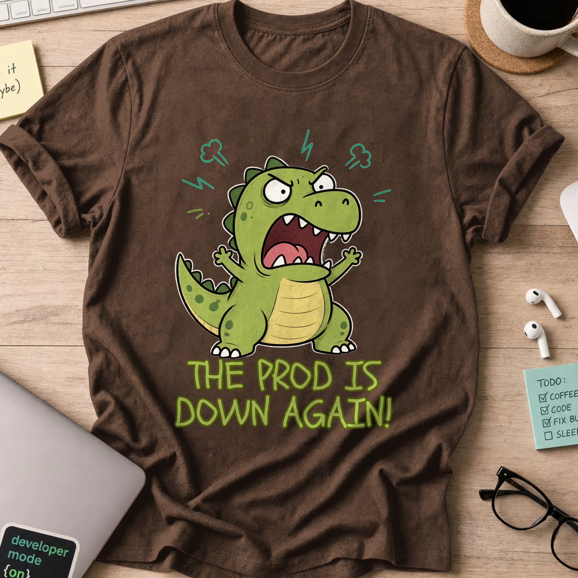 The Prod Is Down Again Cartoon Dinosaur Shirt — Dark Chocolate storefront mockup