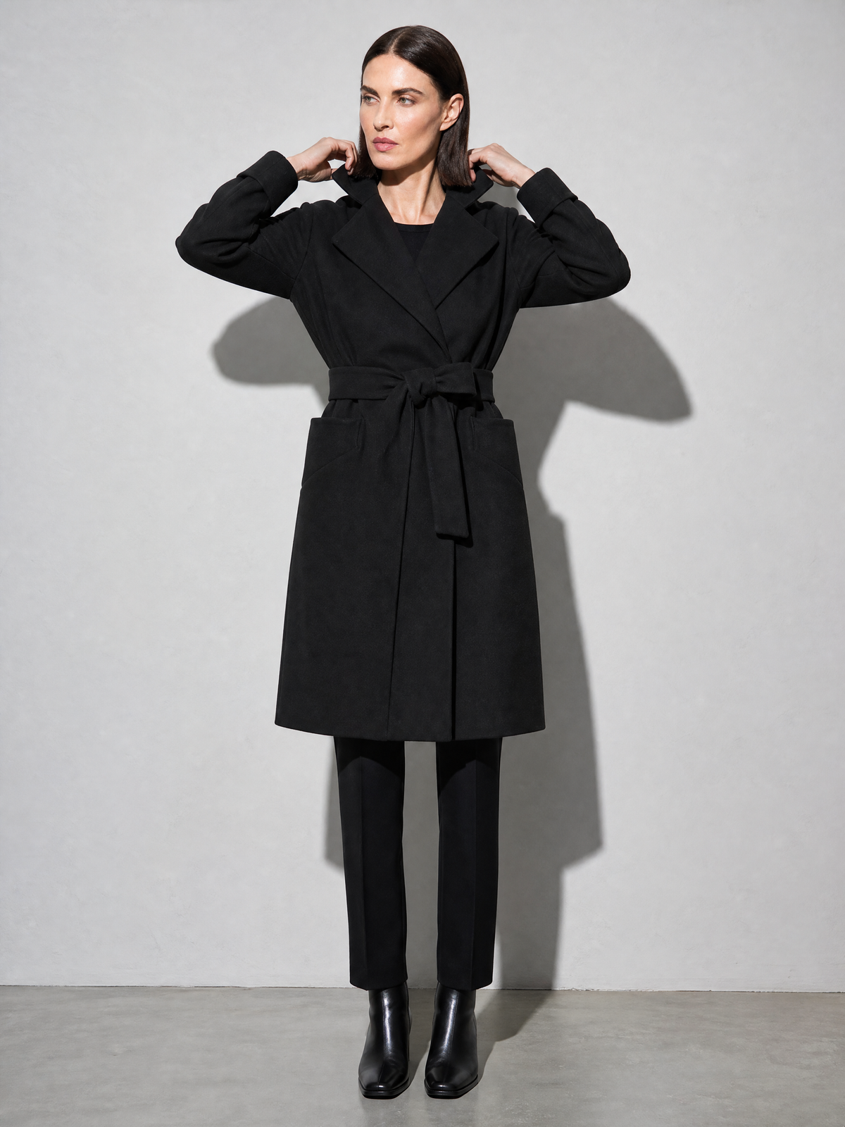 Women's Long Sleeve Woolen Coat in Black - adjusting view