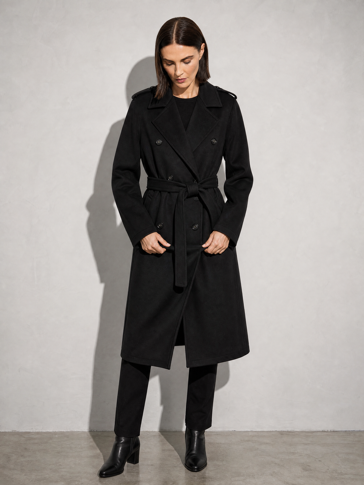 Double-breasted Belted Mid-length Wool Coat in Black - adjusting view