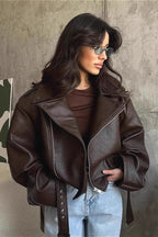 Women's dark brown faux leather moto jacket with belted tie, zip front, angled pockets