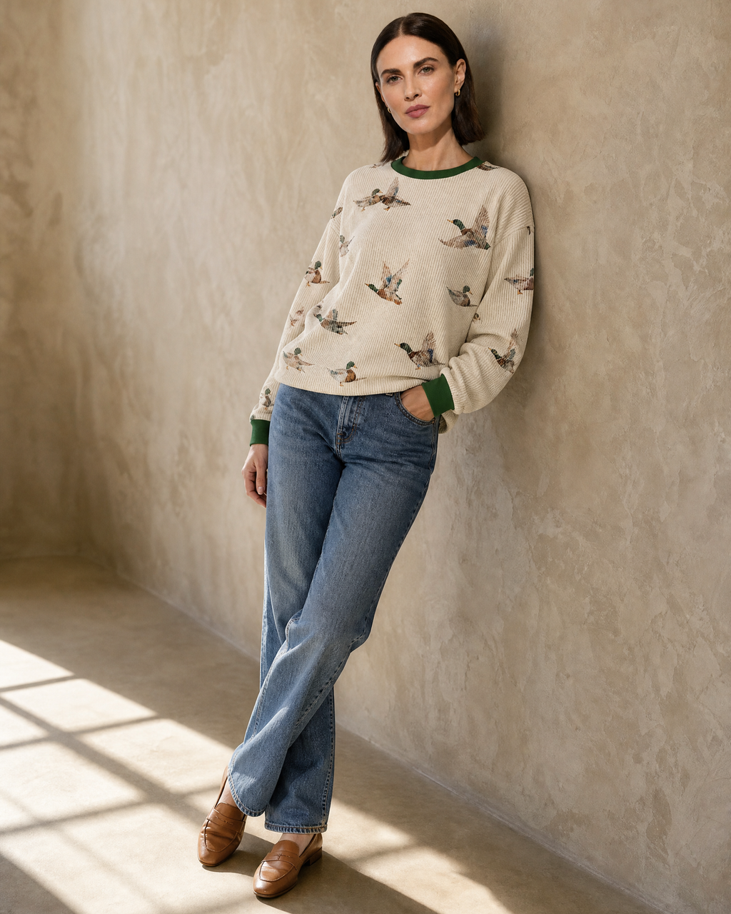 Womens Relaxed-fit Pullover Sweatshirt With An Animal Print in Beige, shoulder wall lean, worn by model