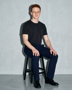 Men's Lightweight Solid Crewneck T-Shirt, stool, forearms on thighs, worn by model