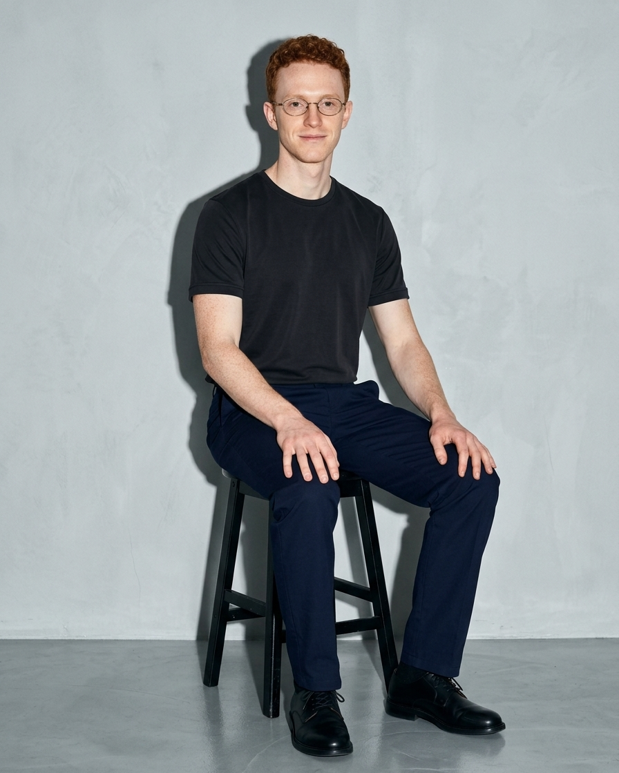 Men's Lightweight Solid Crewneck T-Shirt, stool, forearms on thighs, worn by model