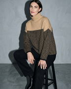 Women's Ribbed Turtleneck Knit Sweater, stool, forearms on thighs, worn by model