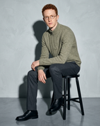 Men's Stand-Collar Cable-Knit Zip Sweater, stool, forearms on thighs, worn by model