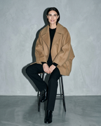 Women's Batwing-Sleeve Lapel Coat, stool, legs crossed, worn by model