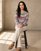 Women's Fashionable Pullover Sweater Top in Blue, stool, legs crossed, worn by model