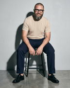 Men's Lightweight Solid Crewneck T-Shirt, perched on stool edge, worn by model