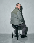 Duck Down Down Jacket Men's Winter American Outdoor, stool, back turned, worn by model