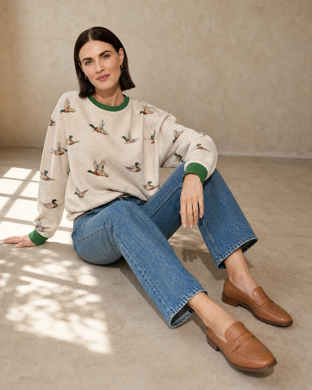 Womens Relaxed-fit Pullover Sweatshirt With An Animal Print in Beige, floor, legs extended, worn by model