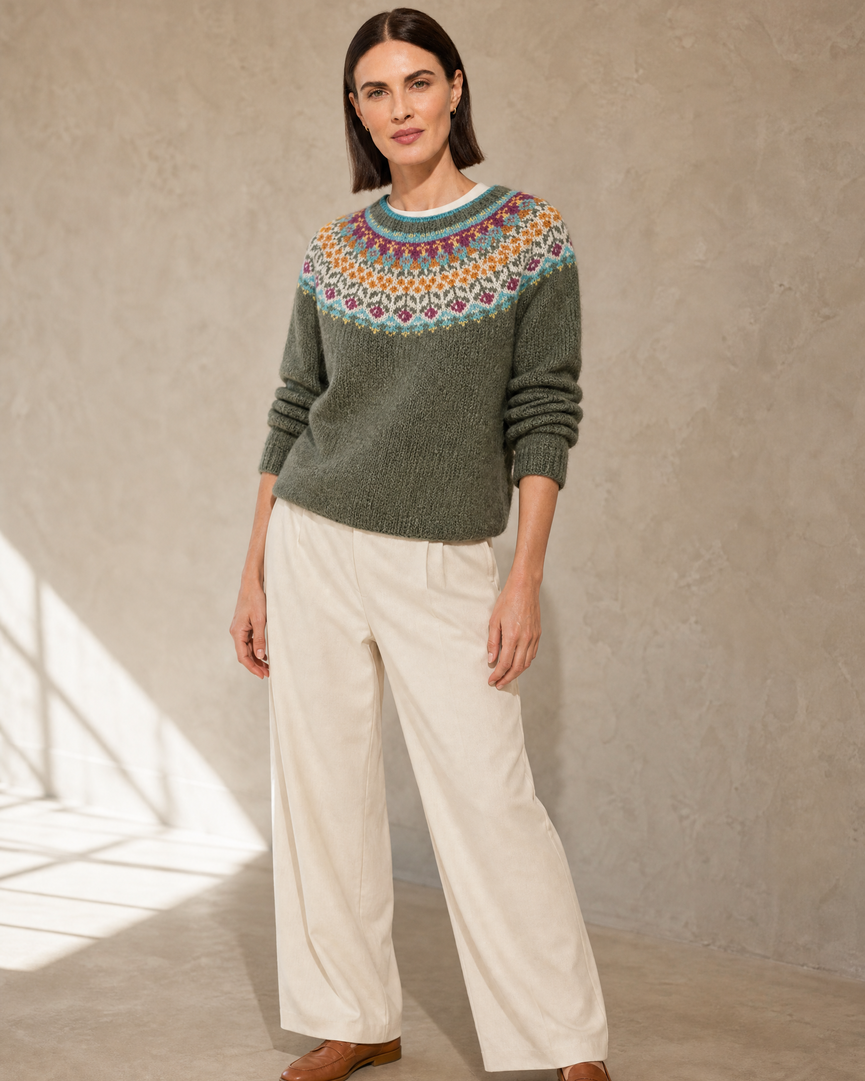 Women's Fashionable Pullover Sweater Top in Light Green, sleeves pushed, arms down, worn by model