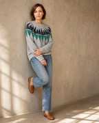 Women's Fashionable Pullover Sweater Top in Teal, wall lean, arms crossed low, worn by model
