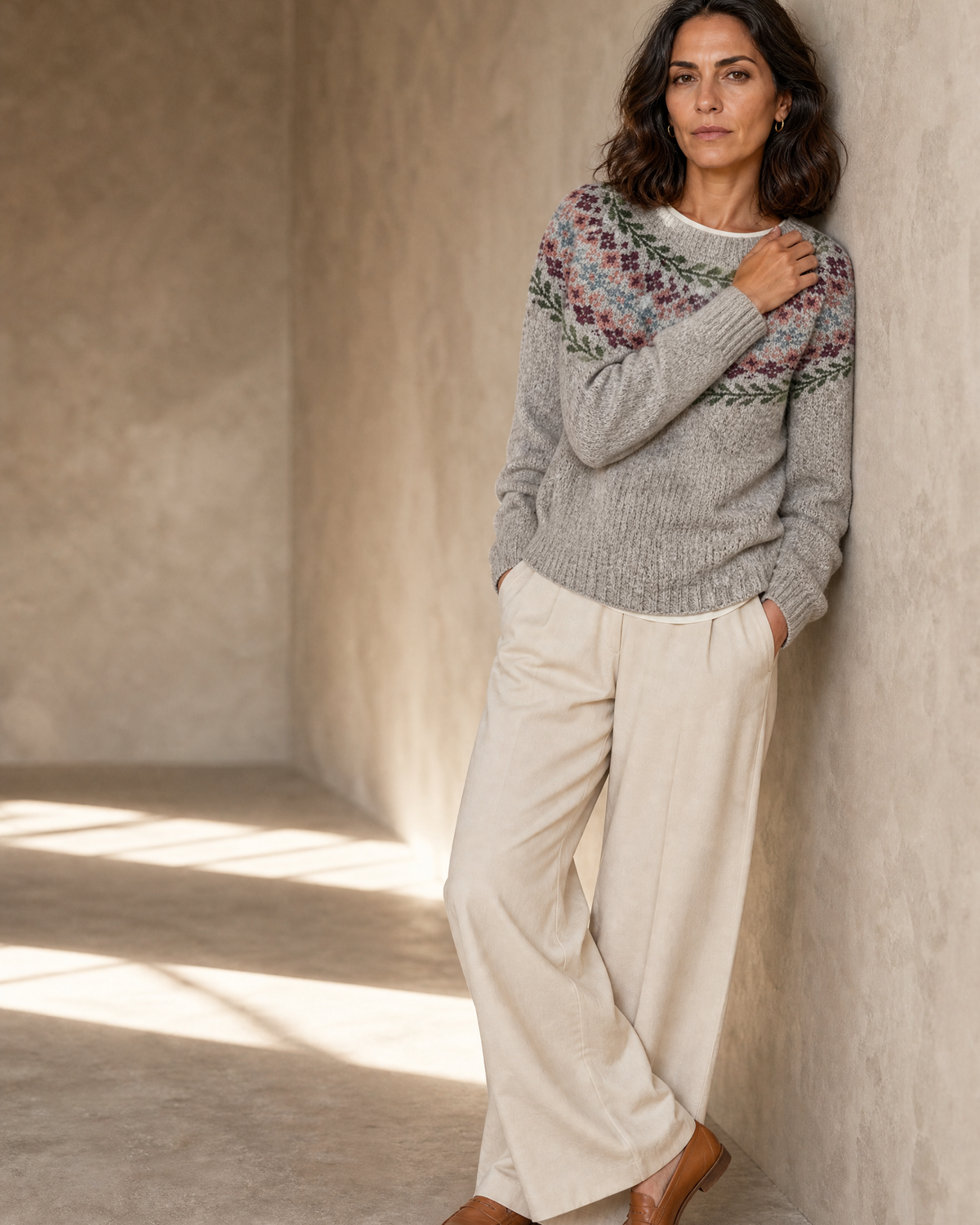 Women's Fashionable Pullover Sweater Top in Grey, wall lean, one hand raised to shoulder, worn by model