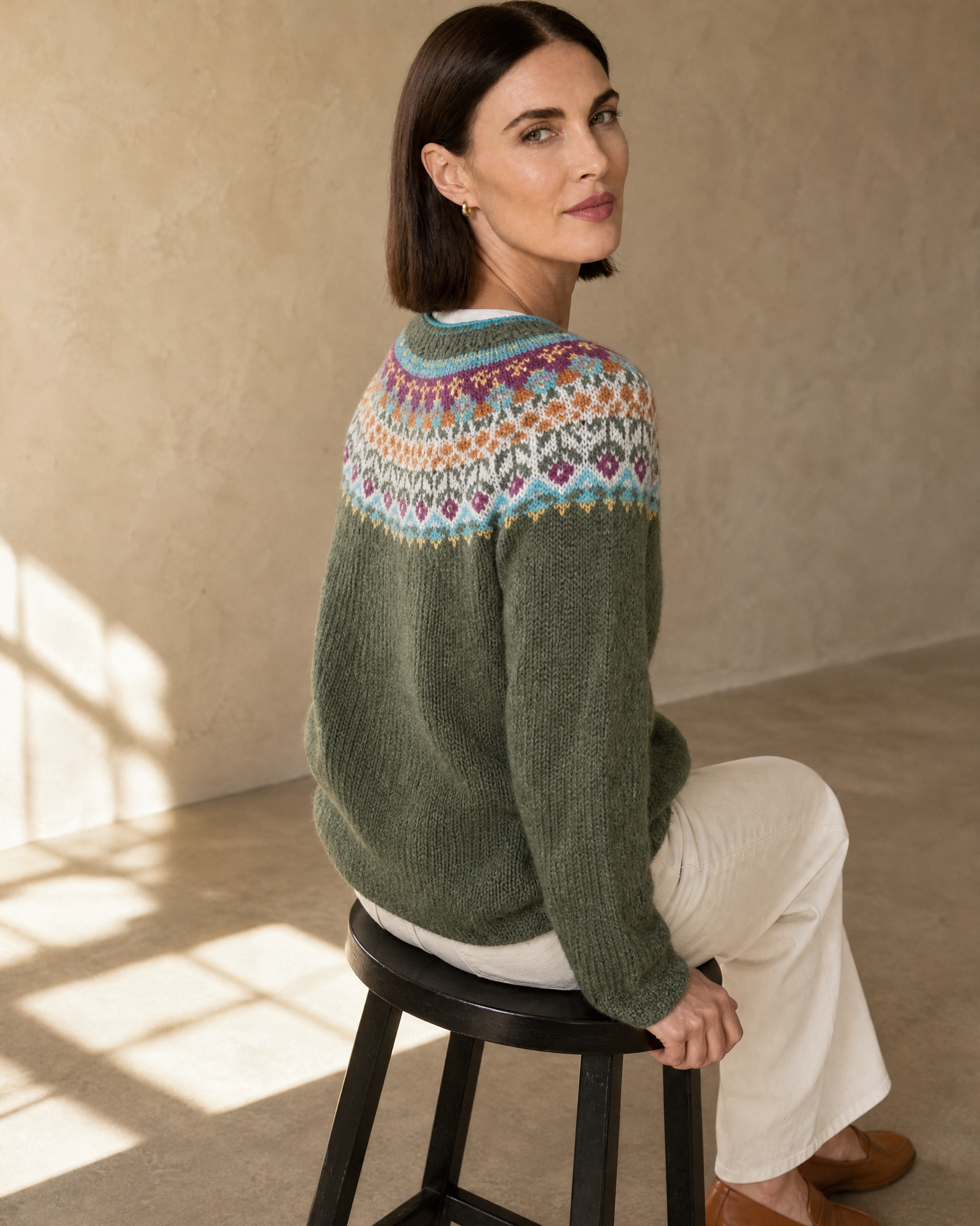 Women's Fashionable Pullover Sweater Top in Light Green, stool, turned away, head back, worn by model