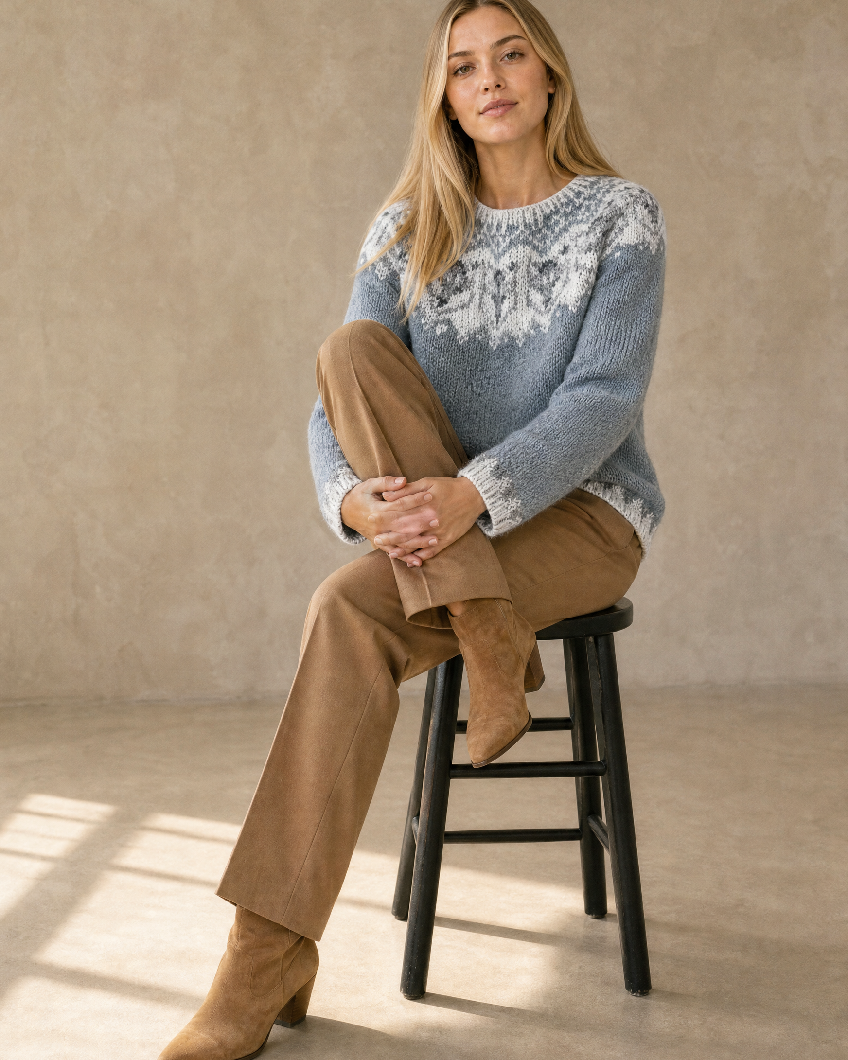 Women's Fashionable Pullover Sweater Top in Silver, stool, one knee drawn up, worn by model