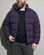 Solid Color Jacket For Men And Women, bust-to-thigh, one hand at hem, worn by model