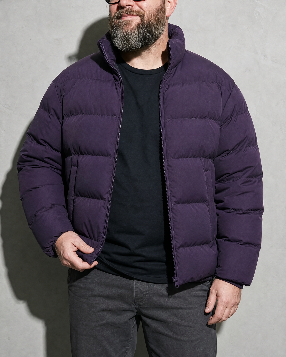 Solid Color Jacket For Men And Women, bust-to-thigh, one hand at hem, worn by model